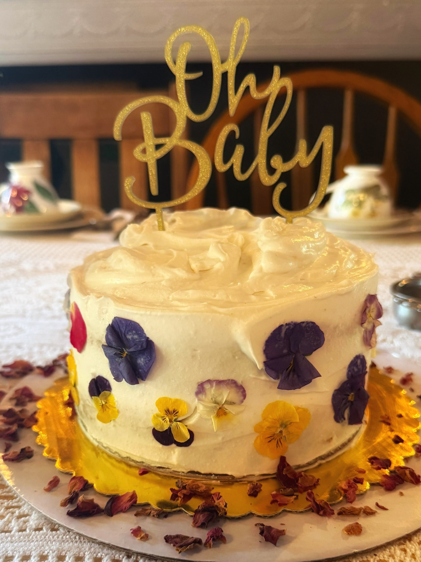 Vegan baby shower cake decorated with pressed edible flowers